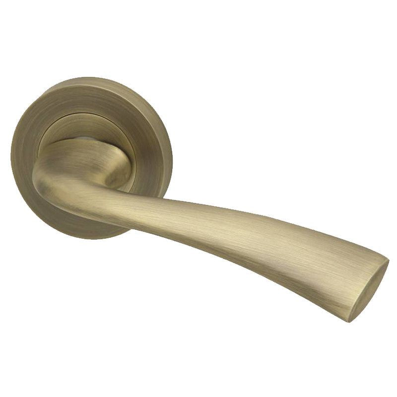 Intelligent Hardware Scimitar Lever in Matt Antique Brass on Round Rose Door Handles