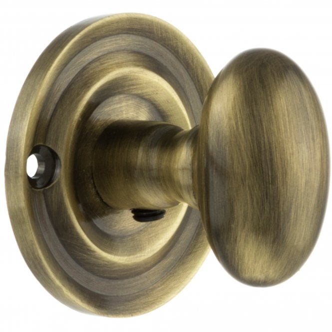 Old English WC Turn And Release Knob Style On Round Rose In Antique Brass