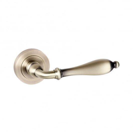 Old English Wrexham Lever On Round Rose Pair Of Door Handles In Matt Antique Brass